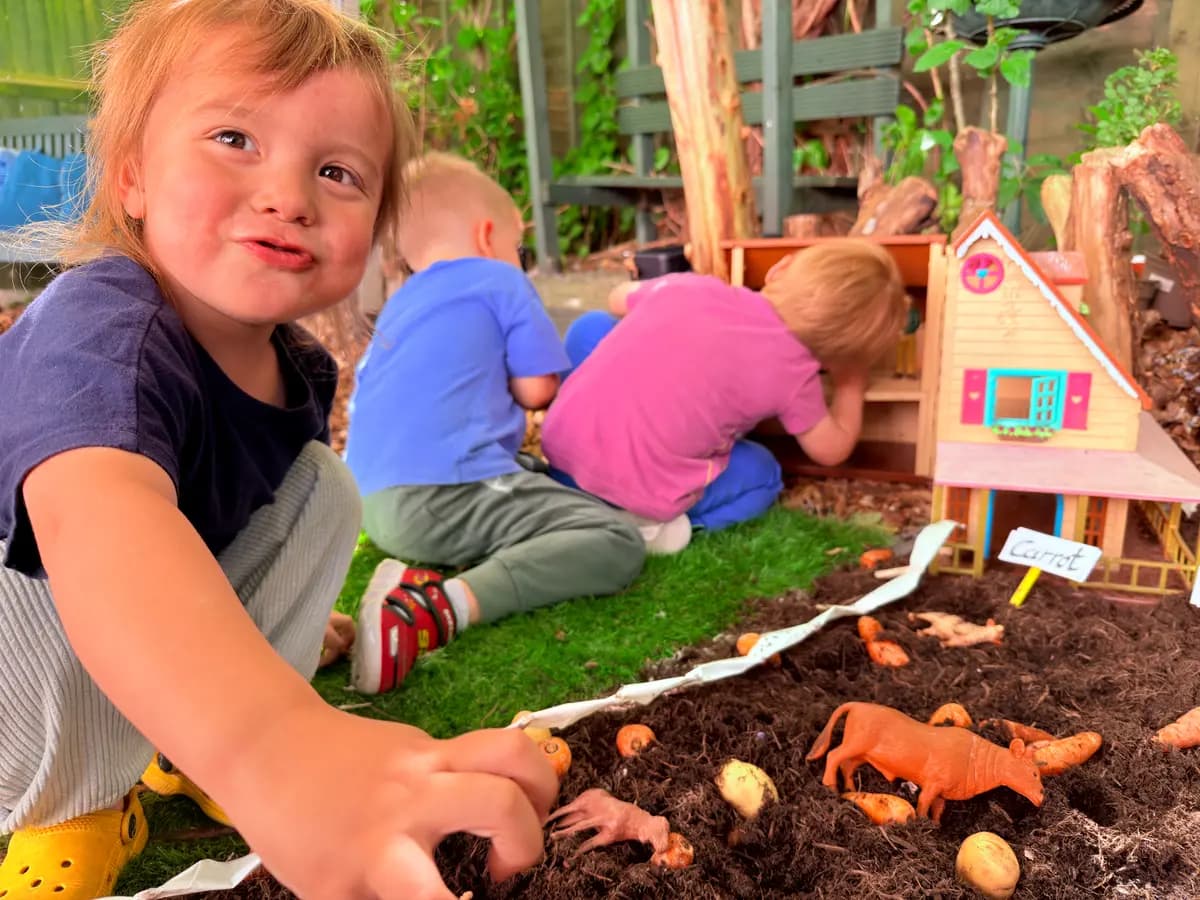 Children exploring outdoor learning and nature at Blue Nest Montessori Harrow