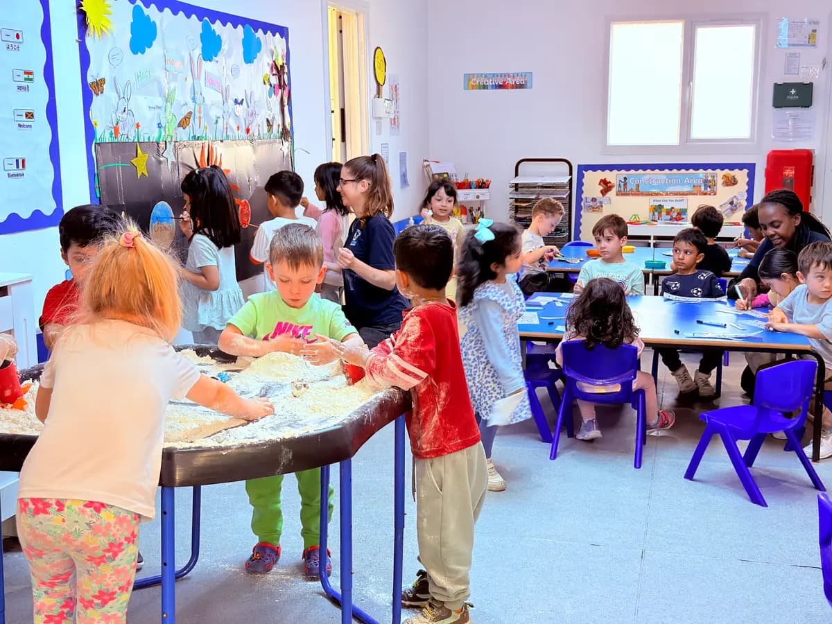 Children engaged in a Montessori learning activity at Blue Nest Montessori Harrow